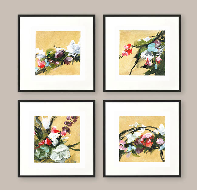 four framed paintings of flowers with gold backgrounds on a mink coloured wall